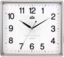 Nástěnné hodiny hranatého tvaru s jemným zdobením uprostřed ciferníku E01.2929