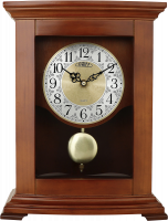 Dřevěné stolní hodiny se zdobeným, částečně pozlaceným, ciferníkem. Krásu hodin vhodně doplňují antické hodinové ručičky a v neposlední řadě nepřehlédnutelné pozlacené kyvadl - PRIM E03.3889.50.A - A